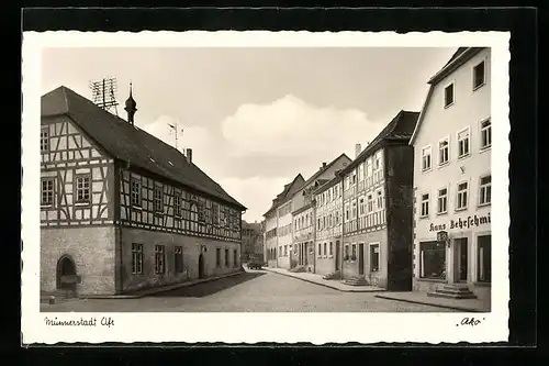 AK Münnerstadt i. Ufr., Strassenpartie mit Geschäften