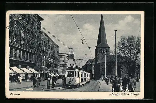 AK Essen, Strassenpartie in der Strasse mit Strassenbahn und Kirche