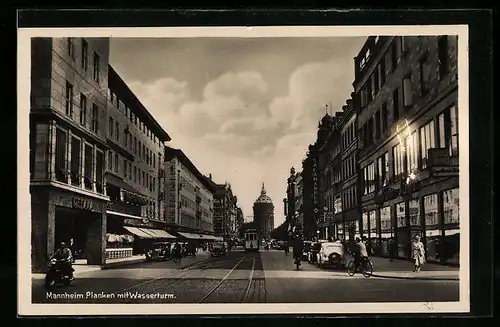 AK Mannheim, Strasse Planken mit Geschäften und Strassenbahn