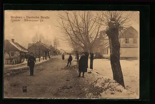 AK Grajewo, Deutsche Strasse mit Soldaten im Winter