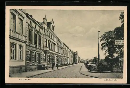 AK Siegburg, Wilhelmstrasse mit Bahnhof der Elektrischen Bahn