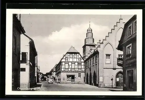 AK Obernburg a. M., Strassenpartie mit Fachwerkhaus und Kirche