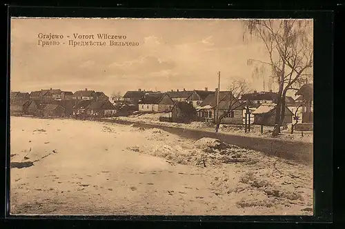 AK Grajewo, Vorort Wilczewo mit Strasse im Winter