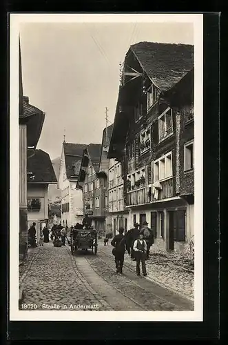 AK Andermatt, Fuhrwerk auf einer belebten Strasse