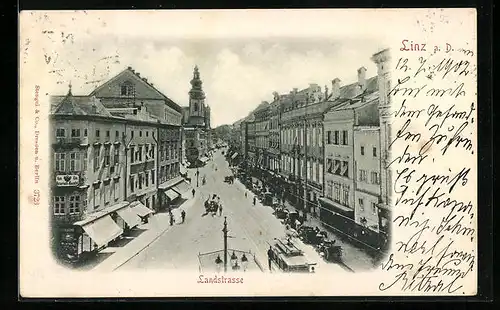 AK Linz a. D., Strassenbahn und Geschäfte in der Landstrasse