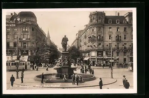 AK Zürich, Strassenbahn am Bahnhofplatz mit Escher-Denkmal