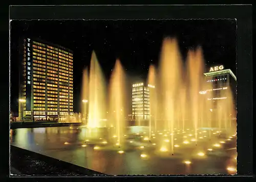 AK Berlin, Ernst-Reuter-Platz mit Wasserspielen bei Nacht