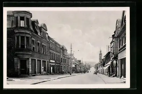 AK Freimengen, Strasse mit Autos