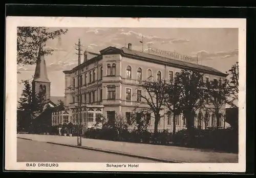 AK Bad Driburg, Schapers Hotel mit Kirche und Strasse