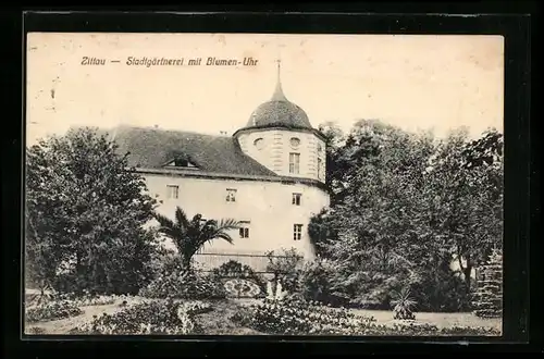 AK Zittau, Stadtgärtnerei mit Blumen-Uhr