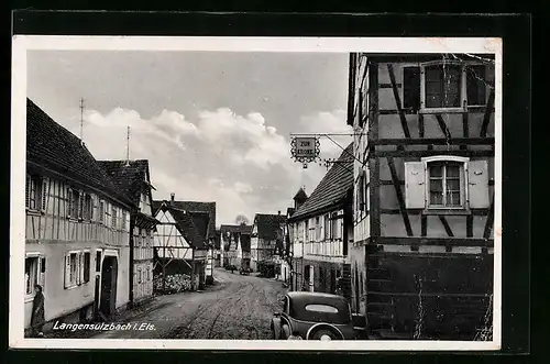 AK Langensulzbach i. Els., Strassenpartie mit Gasthaus zur Krone