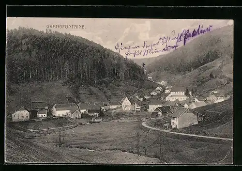 AK Grandfontaine, Ortsansicht mit waldigen Bergen