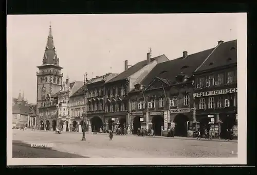 AK Komotau, Ortspartie mit Geschäften und Kirche