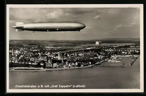 AK Friedrichshafen a. B., Graf Zeppelin über dem Ort