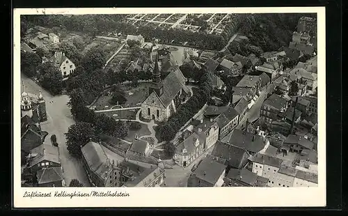 AK Kellinghusen / Holst., Ortspartie mit Kirche vom Flugzeug aus gesehen