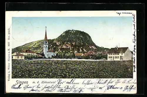 Goldfenster-AK Singen, Teilansicht mit kirche und mit d. Hohentwiel mit leuchtenden Fenstern