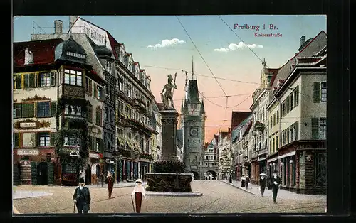 AK Freiburg i. Br., Kaiserstrasse mit Denkmal und Menschen