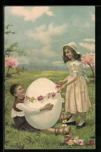 AK Kinder mit riesigem Osterei im Gras
