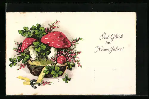 Künstler-AK Neujahrsgrüsse, Korb mit Fliegenpilzen, Kleeblättern und Hufeisen
