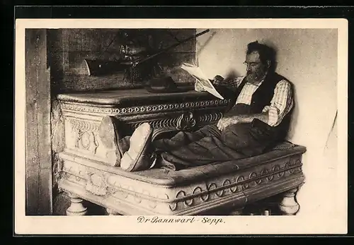 AK Dr Bannwart-Sepp sitzt lesend neben Hut und Gewehr
