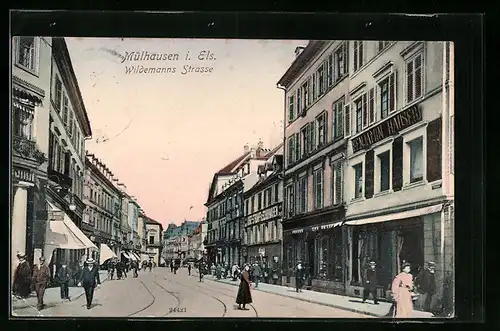 AK Mülhausen i. E., Wildemannstrasse mit Passanten und Geschäften