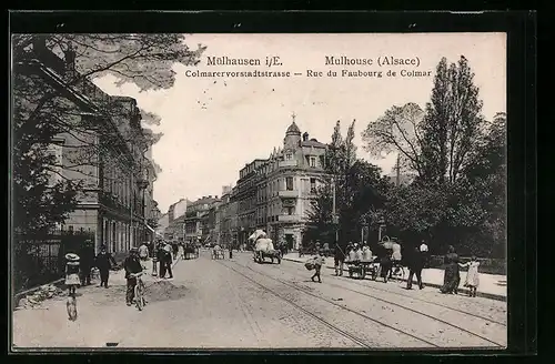 AK Mülhausen i. E., Colmarervorstadtstrasse mit Passanten und Wagen