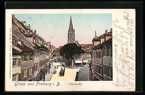 AK Freiburg i. B., Häuserpartie bei Oberlinden mit leuchtenden Fenstern
