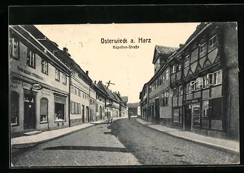 AK Osterwieck i. Harz, Kapellen-Strasse mit Geschäften