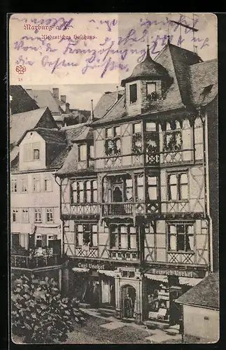 AK Marburg a. L., Altdeutsches Holzhaus mit Geschäft v. Carl u. Heinrich Unckel