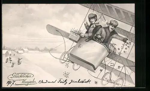 Künstler-AK Fliegerpaar wirft Glücksbringer aus dem Flugzeug