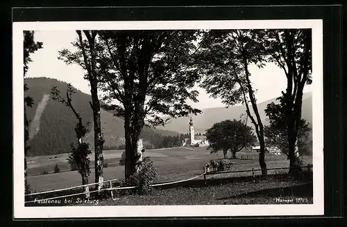 AK Faistenau bei Salzburg, Ortspartie mit Kirche mit Bäumen