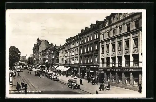 AK Saarbrücken, Geschäfte und Strassenbahn in der Reichsstrasse