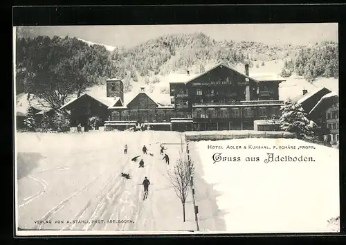 AK Adelboden, Hotel Adler & Kursaal im Winter, Frontansicht mit Skiläufern am Abhang