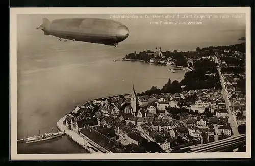 AK Friedrichshafen, Luftschiff LZ 127 Graf Zeppelin über dem Ort