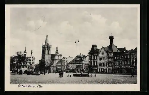 AK Leitmeritz a. Elbe, Strassenpartie mit Brunnen