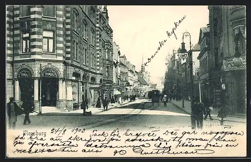 AK Flensburg, Grosse Strasse mit Strassenbahn und Passanten
