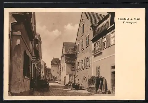 AK Sulzfeld, Friesengasse mit Holzkarren und Bäckerei & Handlung von Jos. Schätz