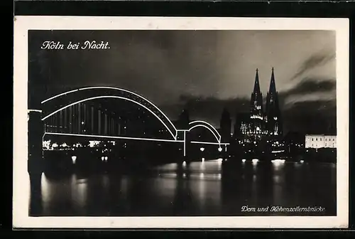 AK Köln, Dom und Hohenzollernbrücke bei Nacht