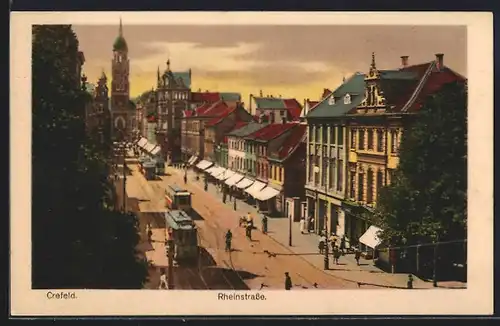 AK Crefeld, Strassenbahnen und Geschäfte in der Rheinstrasse