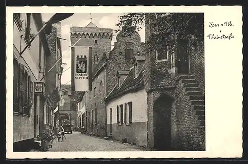 AK Zons a. Rh., Rheinstrasse mit Gasthof St. Peter