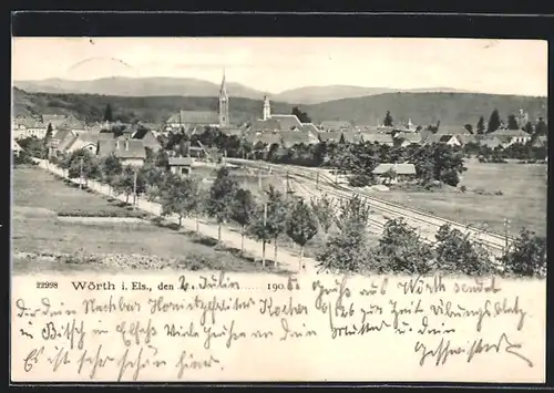 AK Wörth i. Els., Ortsansicht mit Landstrasse und Bahnschienen