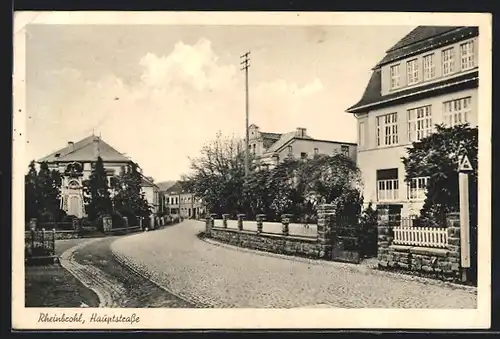 AK Rheinbrohl, Hauptstrasse mit Denkmal