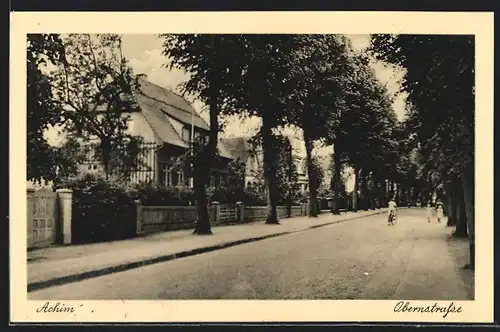 AK Achim, Obernstrasse mit Radfahrer