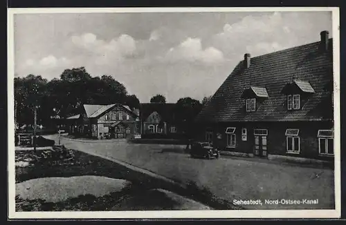 AK Sehestedt /Nord-Ostsee-Kanal, Strassenpartie mit Kaufhaus
