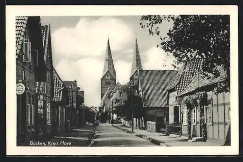 AK Bücken, Strassenszene mit Kirche