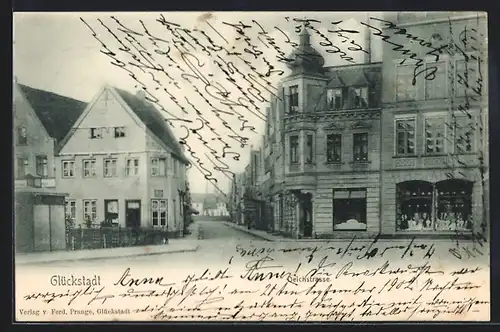 AK Glückstadt, Deichstrasse mit Geschäften