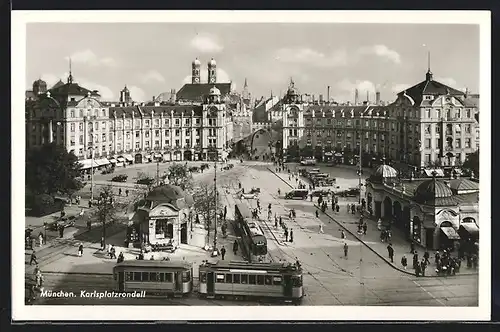 AK München, Karlsplatzrondell mit Strassenbahn, Türme der Frauenkirche