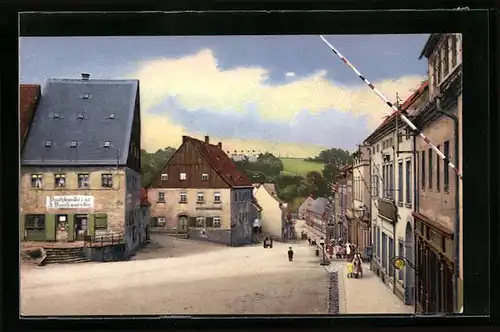 AK Oederan, Langestrasse mit Geschäften nach dem Gewitter