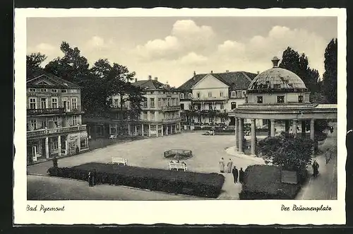 AK Bad Pyrmont, Brunnenplatz mit Hotel-Pension Ockel