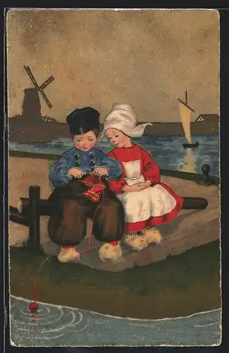 AK Junge und Mädchen in niederländischer Tracht sitzen zusammen auf einer Brücke